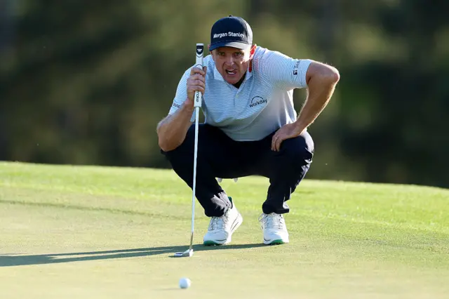 Justin Rose eyes up a putt