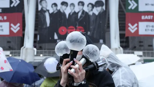 Fans of K-pop boy band BTS wait in line for the BTS World Tour 'Arirang' at Goyang stadium on April 09, 2026 in Goyang