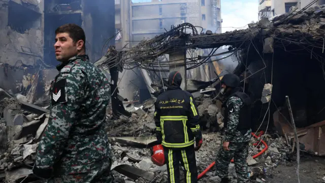 Rescuers stand at the site of an Israeli strike carried out on Wednesday, in Al-Mazraa in Beirut, Lebanon, April 9, 2026