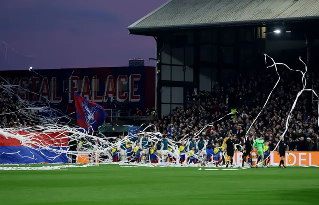 Ticker tape falls down at Selhurst Park