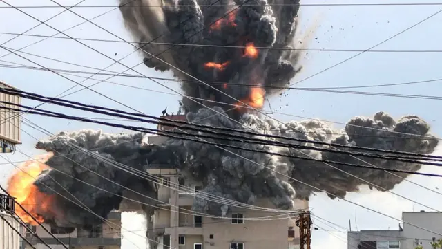 A fireball rises from a building hit by an Israeli airstrike in the area of Abbasiyeh, on the outskirts of the southern Lebanese city of Tyre, on 8 April 2026