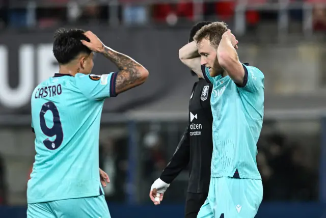 Bologna players put hands to heads