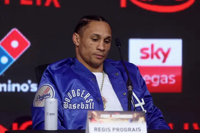 Regis Prograis looks down at a news conference