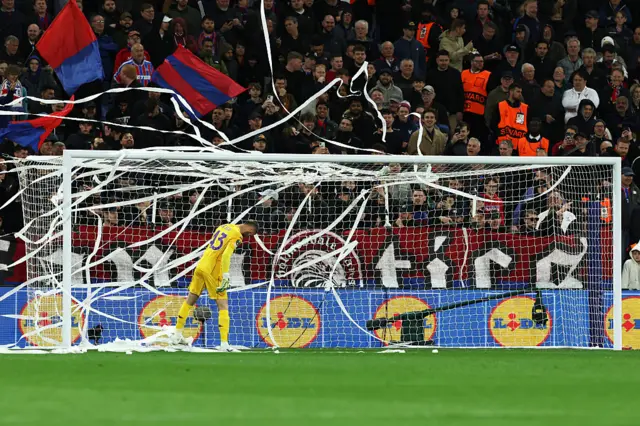 De Gea walks through toilet roll being thrown from the stands