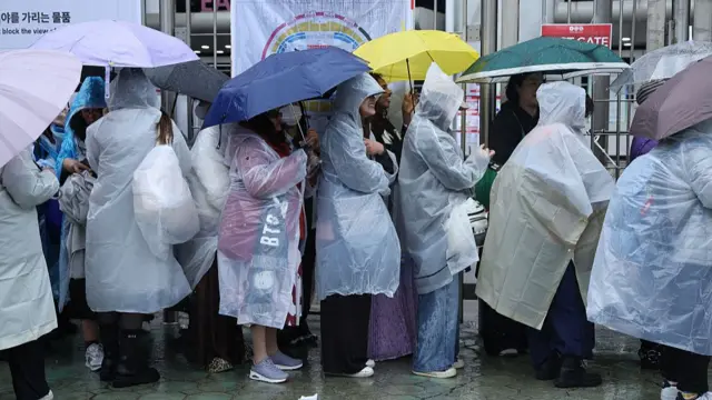 BTS fans wait in line for the concert
