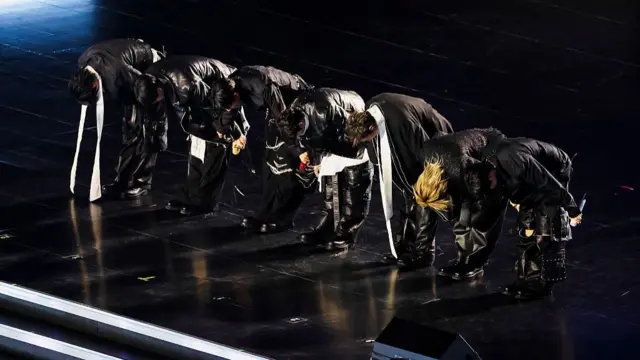 An earlier picture of their signature greeting