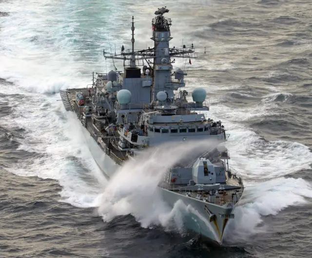 File photo shows a Type 23 frigate HMS St Albans from 2016 sailing through the ocean with spray around it