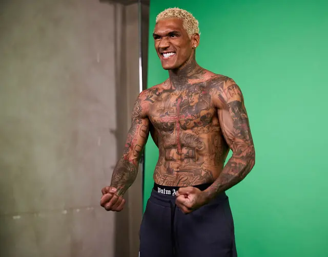 Conor Benn is shirtless and clenching his fists