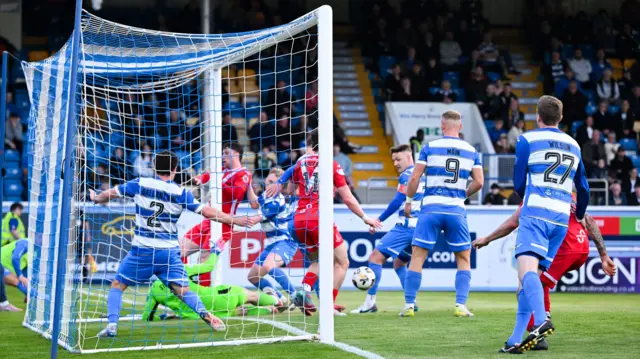 An Airdrieonians chance is cleared off the line during