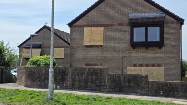 A boarded up house near the site of the explosion at Southway, Plymouth