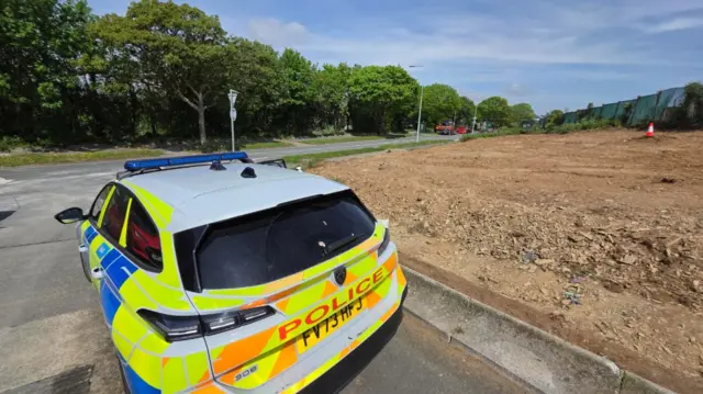 Police car near the site of where the bomb was found