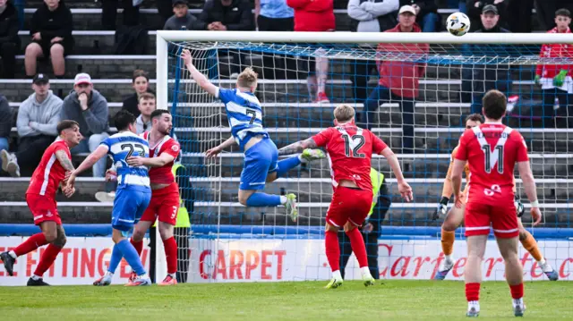 Morton's Owen Moffat (centre) goes close with a headed chance
