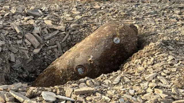 The unexploded ordnance in rubble.