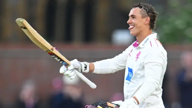 Josh Thomas celebrates scoring century