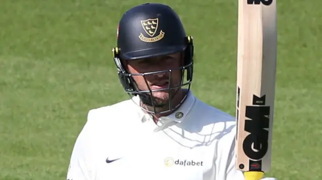 Ollie Robinson celebrates scoring fifty