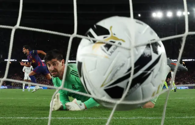 FC Barcelona's Ferran Torres scores their second goal past Real Madrid's Thibaut Courtois