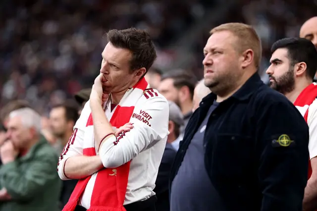Arsenal fans biting their nails in the away end