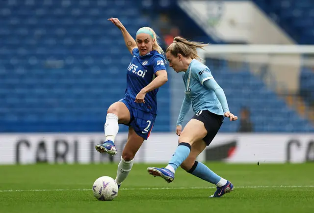 Ellie Carpenter passes the ball