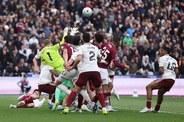 David Raya of Arsenal is fouled by Pablo of West Ham United