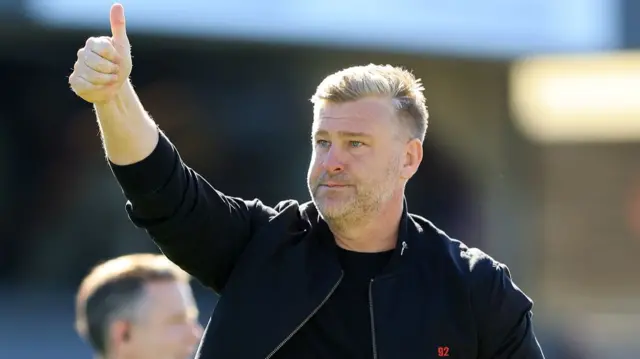 Salford boss Karl Robinson gives a thumbs up