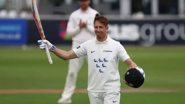 Former Sussex skipper John Simpson raises his bat