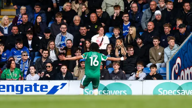 Jayden Luker celebrates in front of the Chesterfield fans