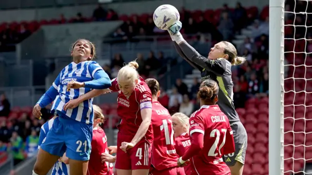 Jennifer Falk punches the ball
