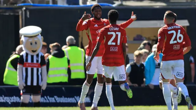 Adebola Oluwo celebrates for Salford