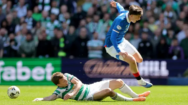 Alistair Johnston fouls Mikey Moore