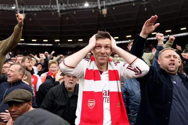 An Arsenal fan reacts