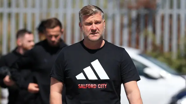 Salford City boss Karl Robinson arrives at Grimsby