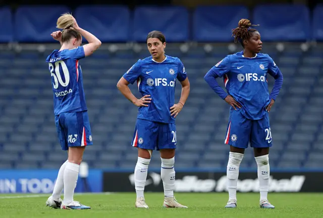 Chelsea players stand around
