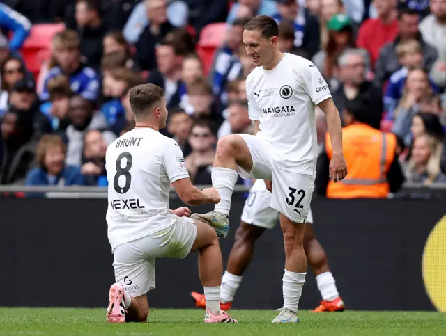 Matt Rush of Boreham Wood celebrates scoring his team's first goal with teammate Zak Brunt