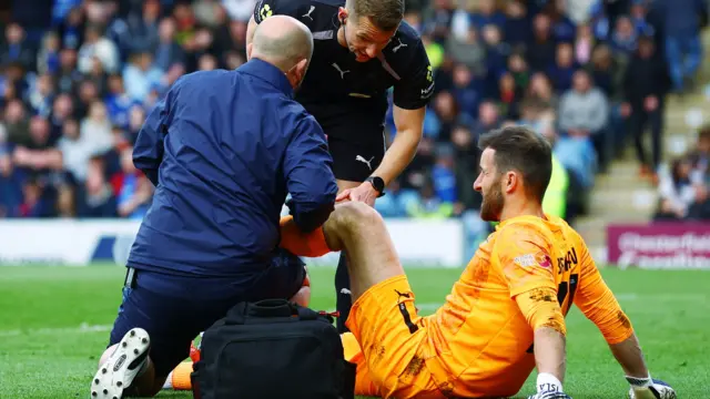 Notts County's James Belshaw receives treatment