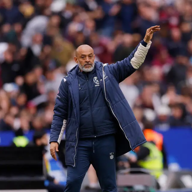 Nuno waves his arms at his players from the sideline