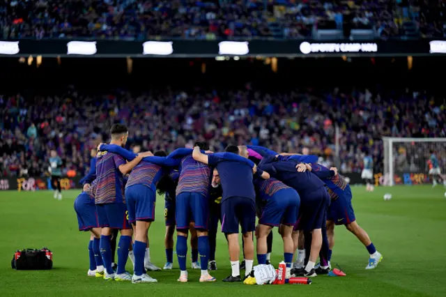 Players of FC Barcelona huddle