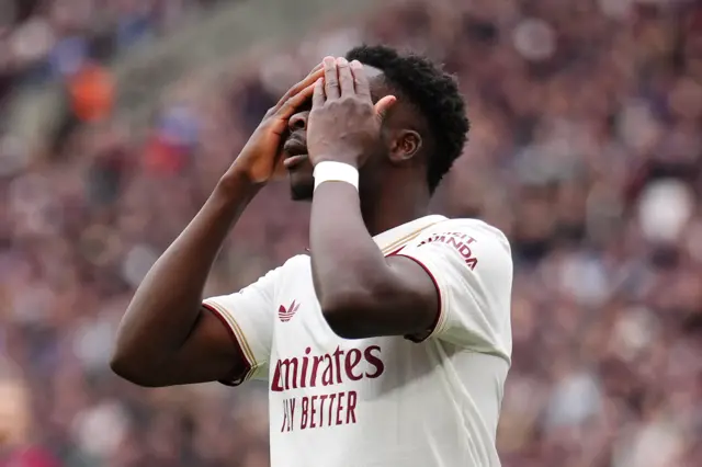 Arsenal's Bukayo Saka reacts after a missed opportunity