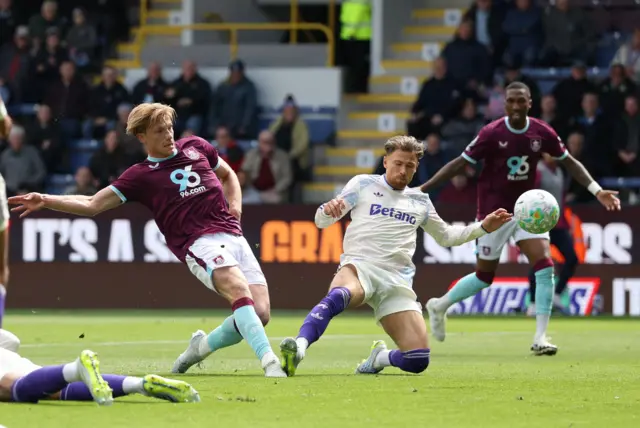 Burnley v Aston Villa - Turf Moor, Burnley, Britain - May 10, 2026 Burnley's Zian Flemming shoots at goal as Aston Villa's Matty Cash reacts.
