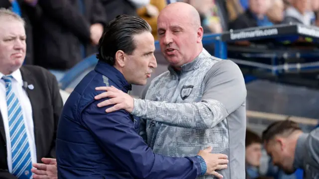 Paul Cook greets Martin Paterson before kick-off