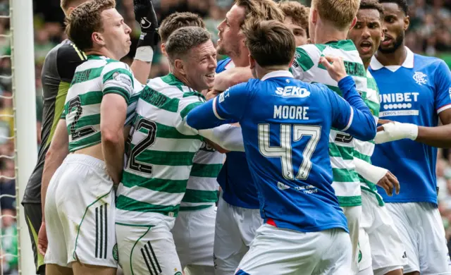 Rangers' Mikey Moore (R) remonstrates with Celtic's Viljami Sinisalo (L) and Callum McGregor (C) during a William Hill Premiership match between Celtic and Rangers at Celtic Park, on May 10, 2026, in Glasgow, Scotland