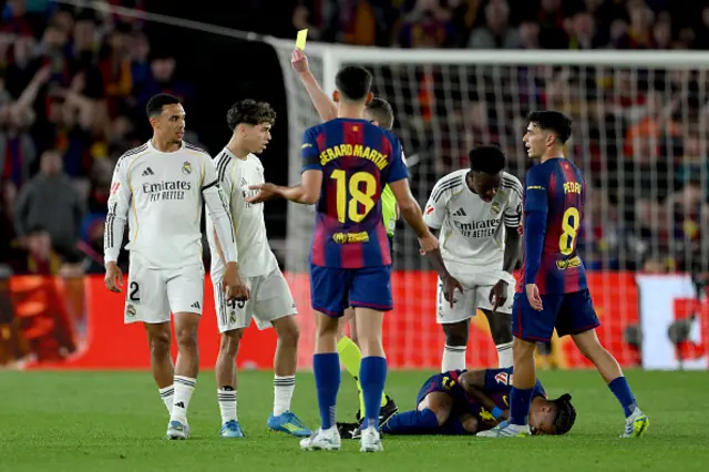 Referee Alejandro Hernandez Hernandez shows a yellow card to Trent Alexander-Arnold