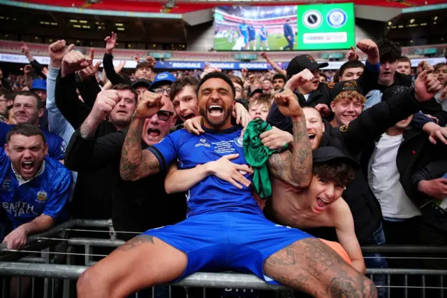 Rochdale's Tobi Adebayo-Rowling celebrates with fans