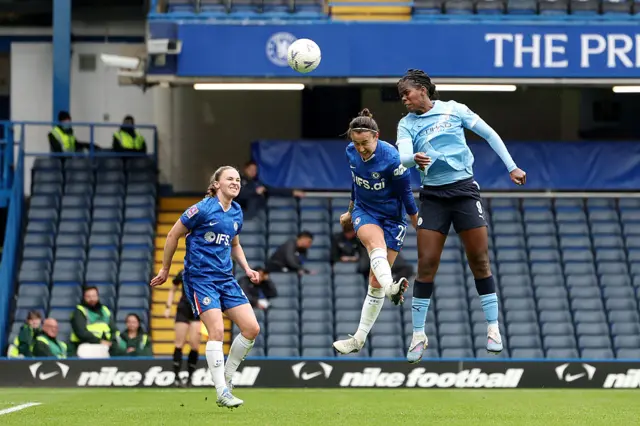 Khadija Shaw heads in