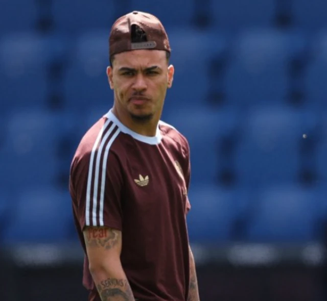 Morgan Rogers wearing a brown adidas t-shirt and baseball cap