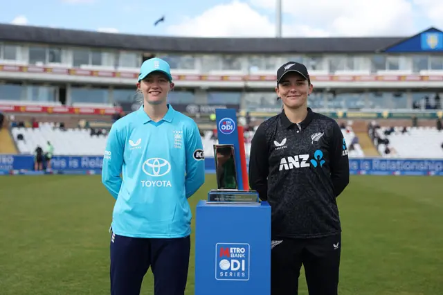 Charlie Dean and Melie Kerr pose with series trophy