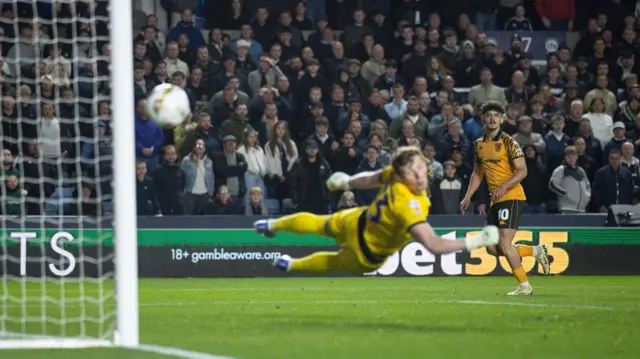 Mo Belloumi's shot curls into the far corner of the Millwall goal