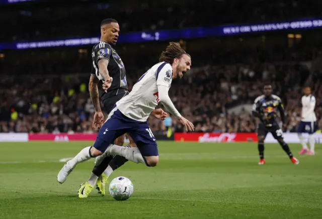 Maddison falls to the floor under contact from Nmecha