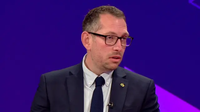 Steve Wright in grey shirt and dark blue tie appearing on BBC Breakfast