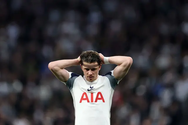 Gallagher puts his hands to his head