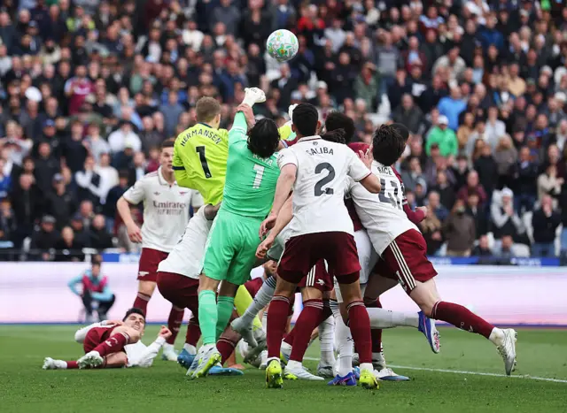 David Raya of Arsenal is fouled by Pablo of West Ham United
